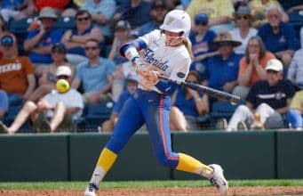 Florida Gators right fielder Taylor Shumaker hits against Texas- 1280x853