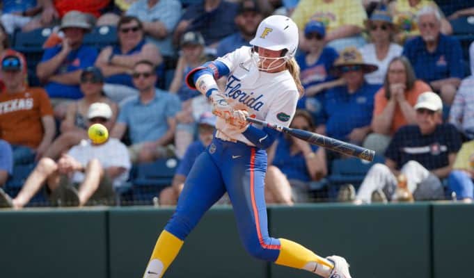 Florida Gators right fielder Taylor Shumaker hits against Texas- 1280x853